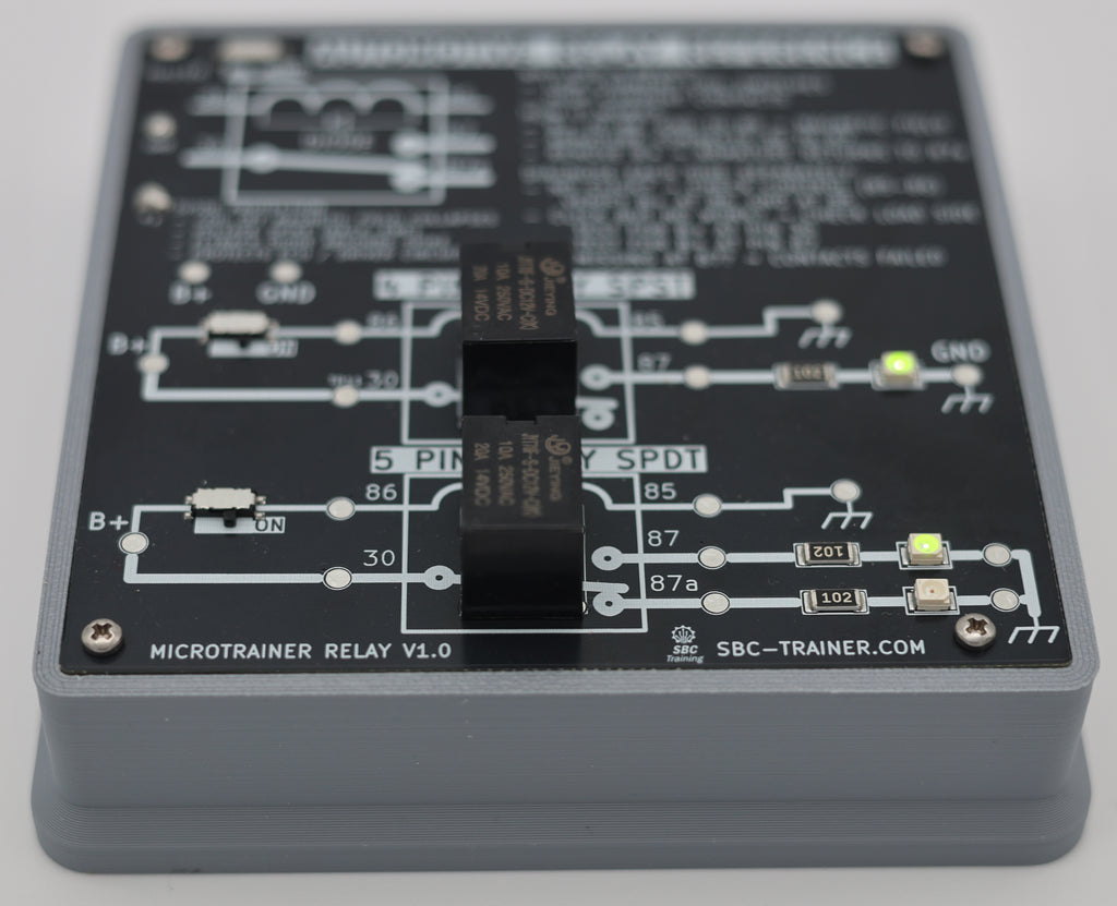 MicroTrainer Relay angled view showing 5-pin SPDT relay section with LEDs illuminated