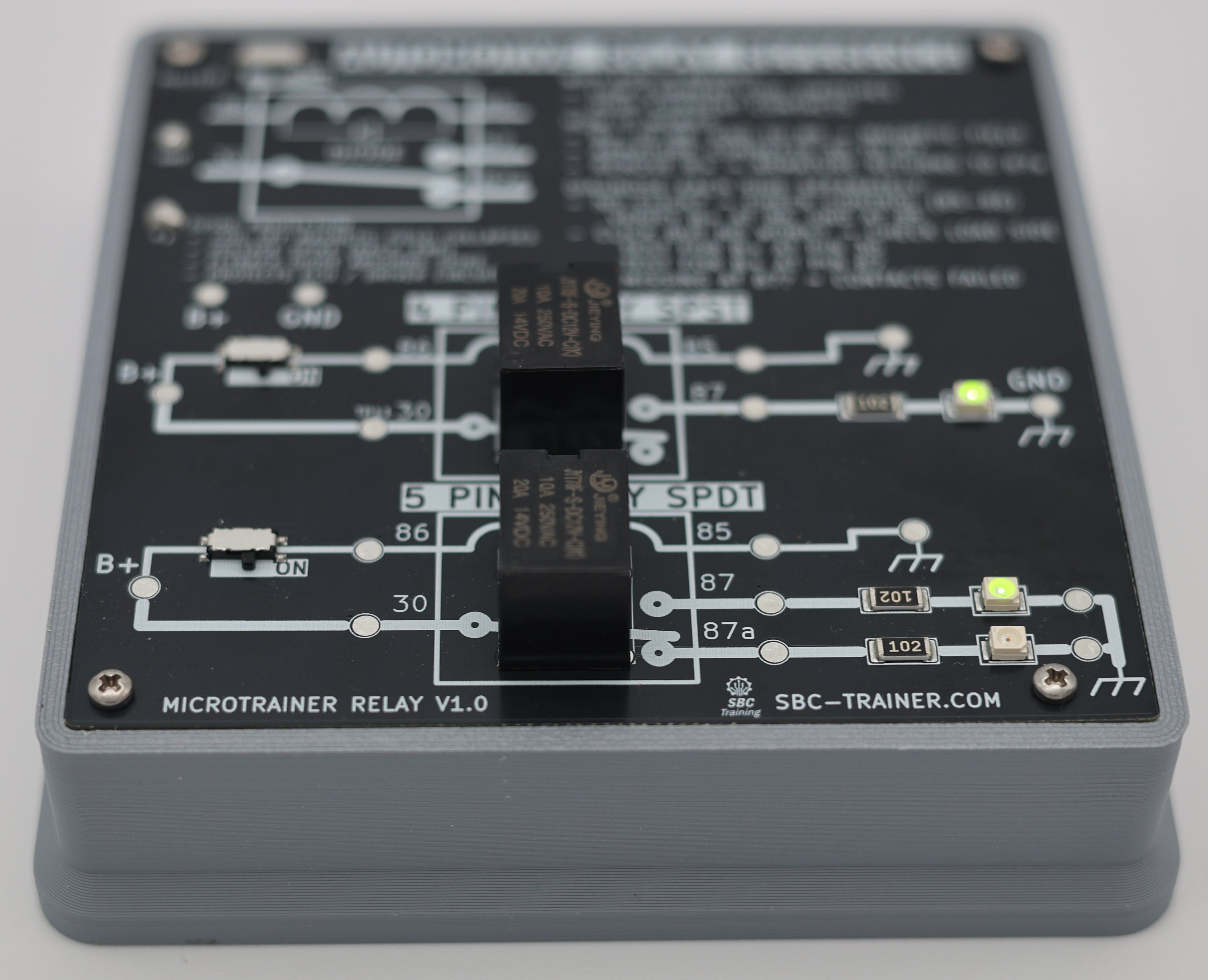 MicroTrainer Relay angled view showing 5-pin SPDT relay section with LEDs illuminated